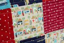 Load image into Gallery viewer, Beachy Reds and Blues Baby Quilt