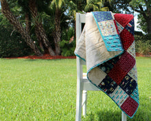 Load image into Gallery viewer, Beachy Reds and Blues Baby Quilt