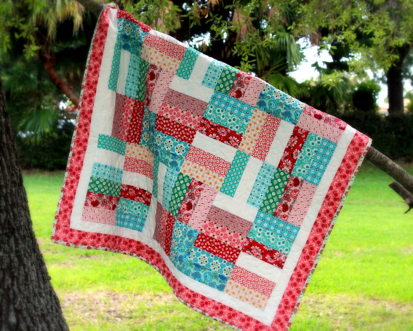Pink and Blue Strip Patchwork Quilt